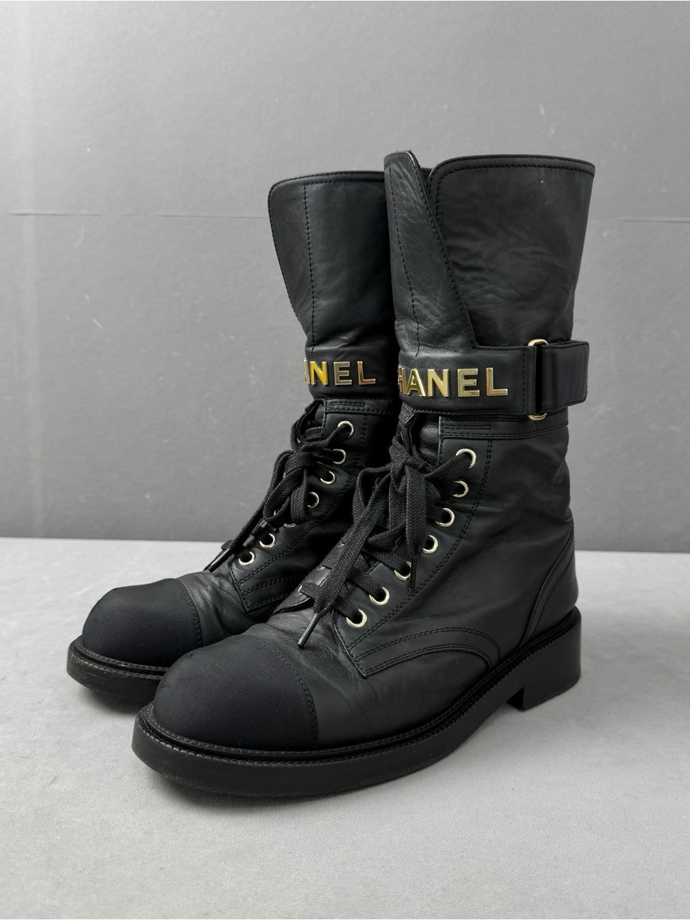 CHANEL Black Leather Lace-Up Mid-Calf Boots with Gold Logo Strap